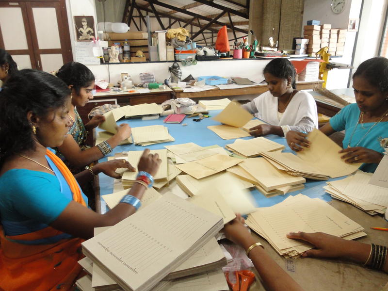 Photographer:Giorgio & Emma | Local Tamil workers constructing date books