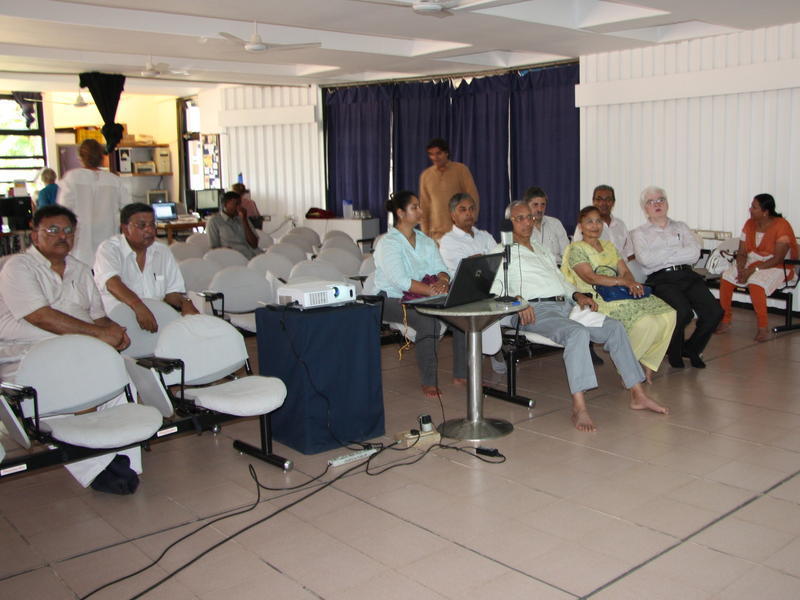 Photographer:Stella | Members of the Sri Aurobindo Society in Auroville Town Hall conference room.