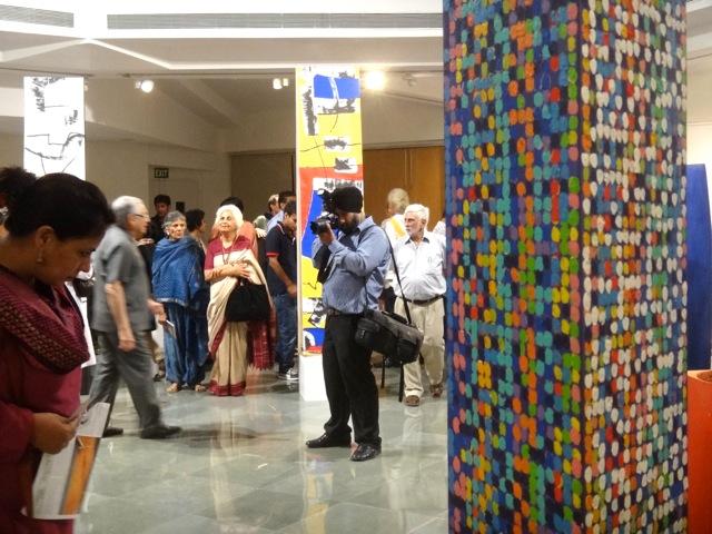 Photographer:Jyothi | Art Exhibition with Aster Patel in the background