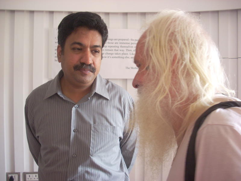 Photographer:Andrea | Dr. Rengaraj Venkatesh talking to Martin, a long time resident of Auroville.