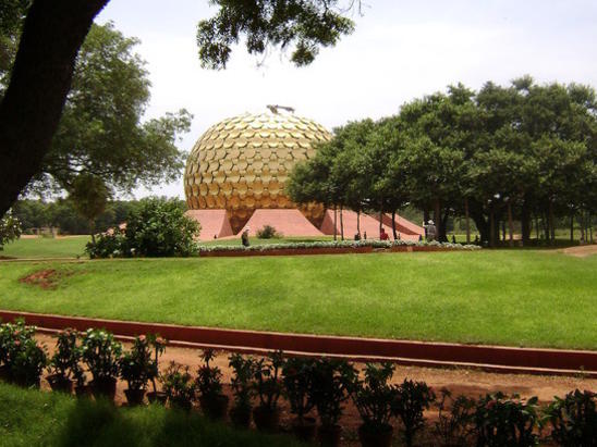 Photographer:Vijay Nambiar | The banyan (as appear today) partially covering the magnificent Matrimandir. 