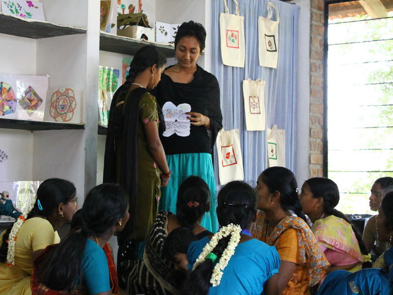 Photographer:Julie | Krupa teaches art therapy to the girls.