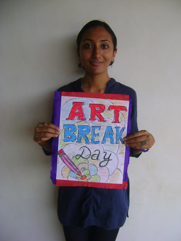Photographer:Clara | Krupa with poster of one of the volunteers 