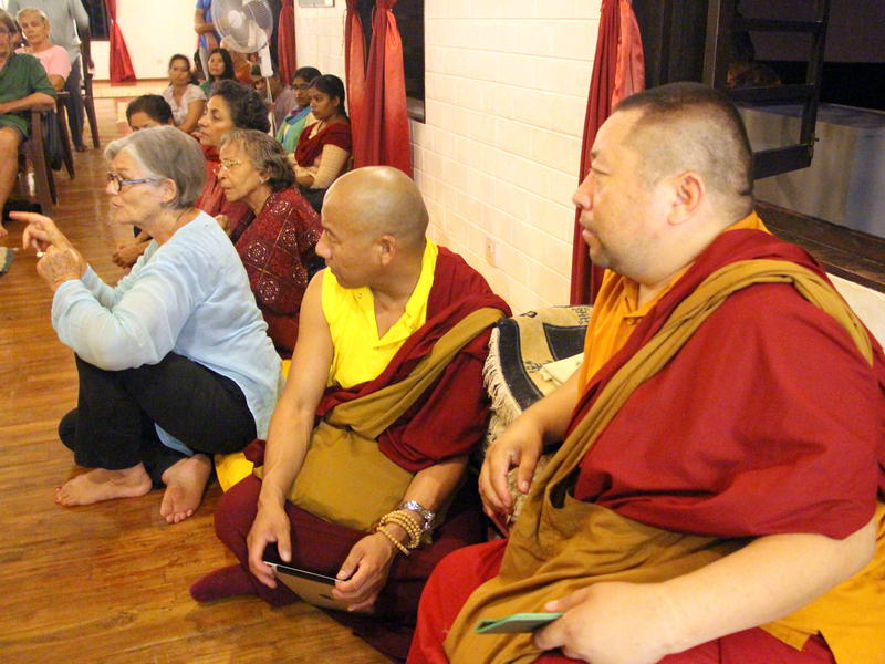 Photographer:Roland | Tibetan monks and Anne Riquier posing a question