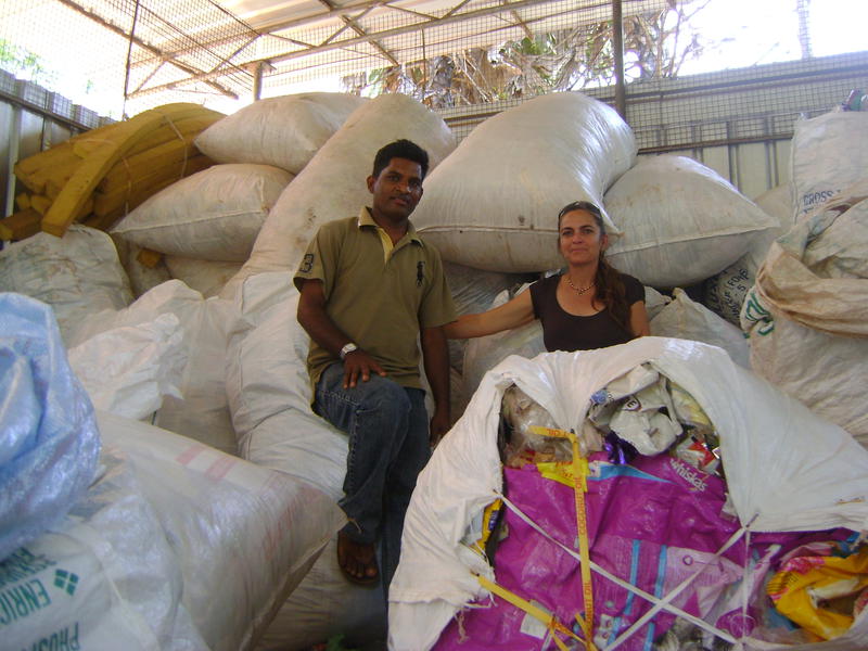 Photographer:Renu | Palani and Kali in front of plastic bags for recycling