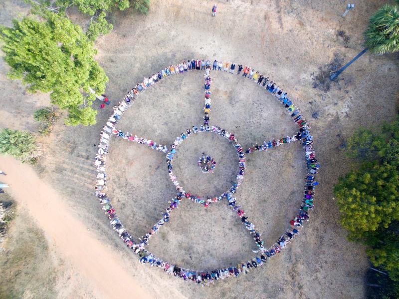 Photographer:Max | Auroville symbol shape formed by people (Drone Capture)