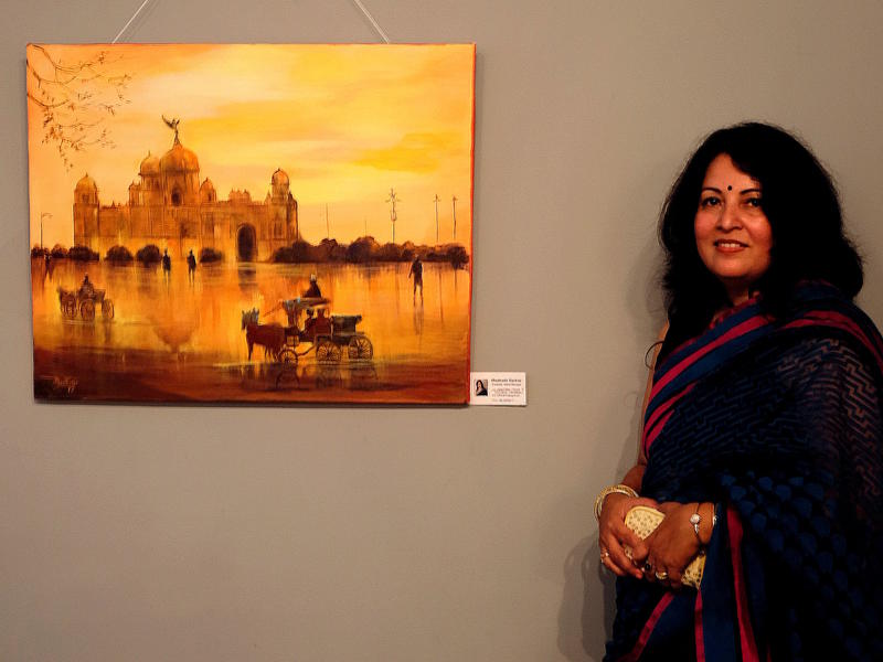 Photographer:Alara | Madhabi Sarkar next to her painting