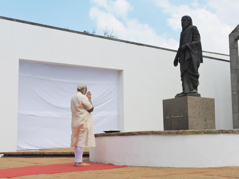 Photographer:Romel | Prime Minister Narendra Modi paying tributes to Sri Aurobindo at Savatri Bhavan, Auroville.