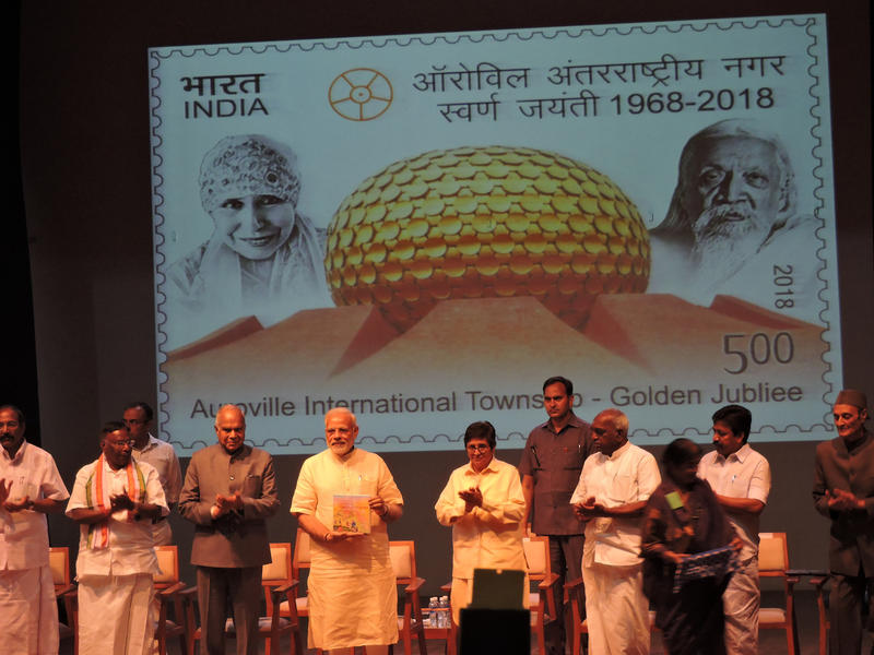 Photographer:Romel | Prime Minister releasing a commemorative postage stamp on the occasion of Auroville's 50th Anniversary.