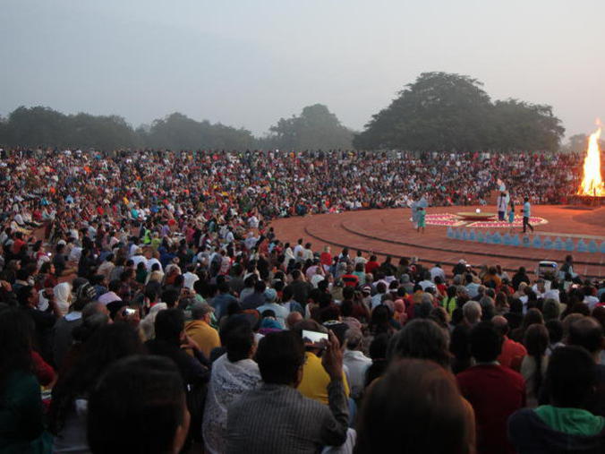 Photographer:The RadioTV team | Thousands witness the event on the occasion of Auroville's 50th Anniversary.