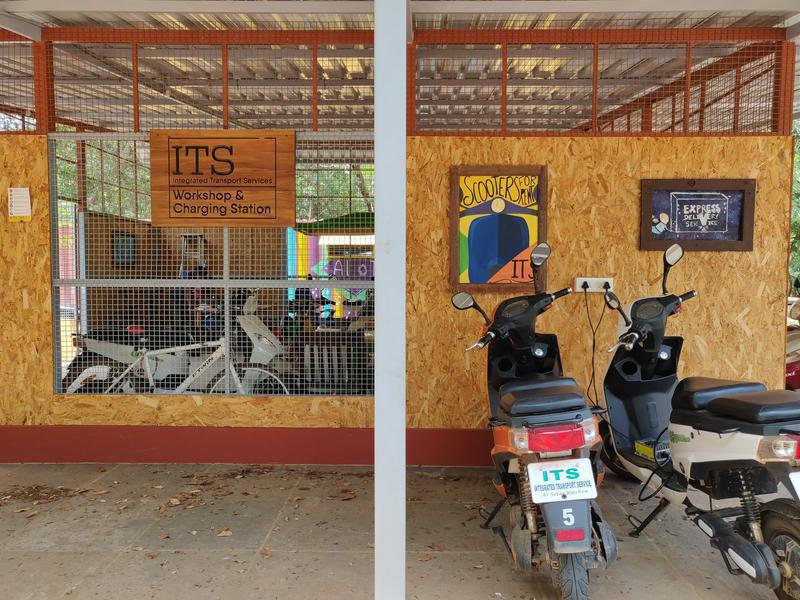 Photographer:Avdhi | Electric scooters charging outside the ITS workshop, opposite Solar Kitchen