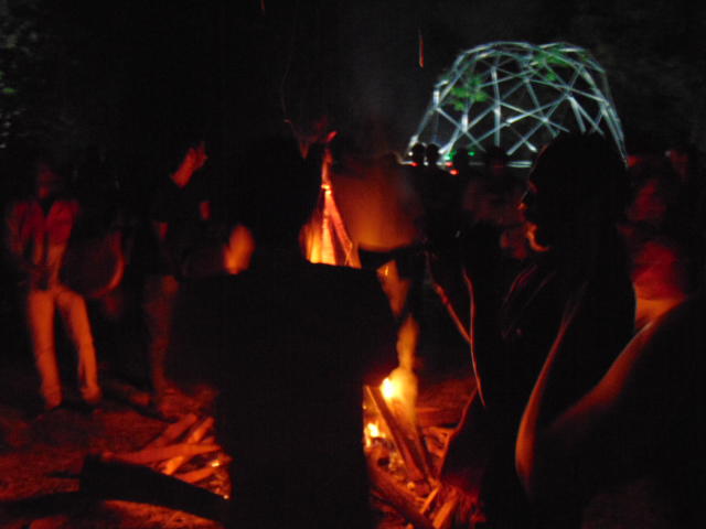 Photographer:Gabriel | Tribe around fire, dome in background