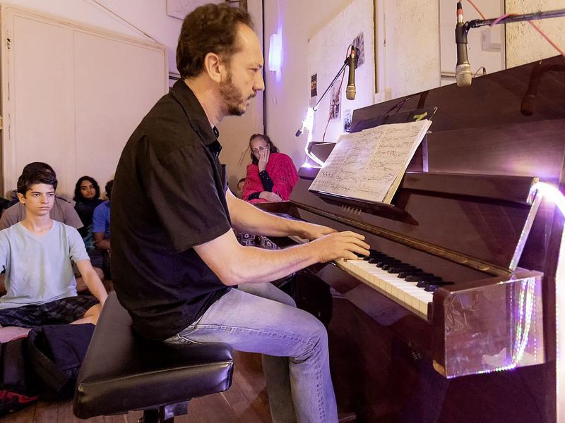 Photographer:Piero Cefaloni | Pushkar Carlotto playing the upright piano at Kalbhumi studio